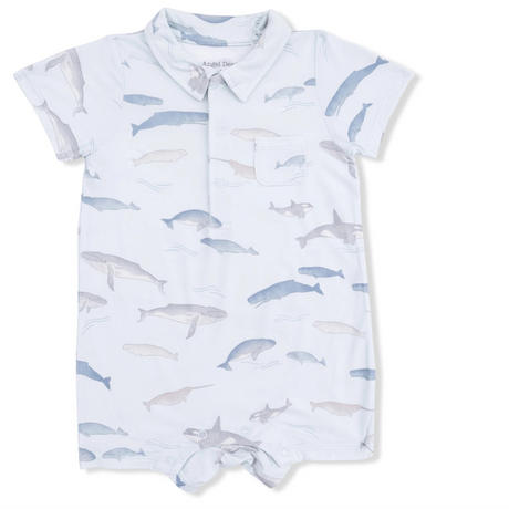 Baby romper and bib set with whale pattern on a white background